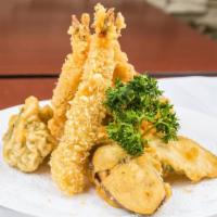 Tempura Appetizer · Three pieces of shrimp and four pieces vegetable.
