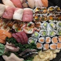 Dinner Combo C · Six pieces of assorted sushi, 15 pieces of assorted sashimi, one California roll, one eel av...