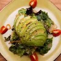 Avocado Salad · Avocado, artisan spring mix, tomatoes and sesame seeds with miso dressing.