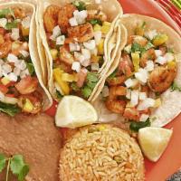 Shrimp Taco Plate  · Served by order of three tacos, shrimp cooked on the grill accompanied with rice and beans, ...
