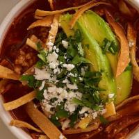 Tortilla Soup · Made with a delicious broth from toasted dried guajillo peppers, fire-roasted tomatoes and c...