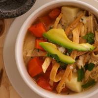 Chicken Soup · Homemade chicken broth with carrots, corn kernels, potatoes, onions and strips of chicken br...