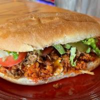 Tortas · Mexican sandwich served in a bun, spread with refried beans, avocado, chipotle dressing, let...