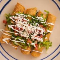 Flautas · Served by order of four crispy corn tortillas filled with shredded chicken breast, topped wi...