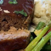 Meat Loaf · Homemade flavorful meat loaf(2) drizzled with our house sauce and your choice of sides
