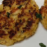 Crab Cakes · Two crab cakes with option of sides.