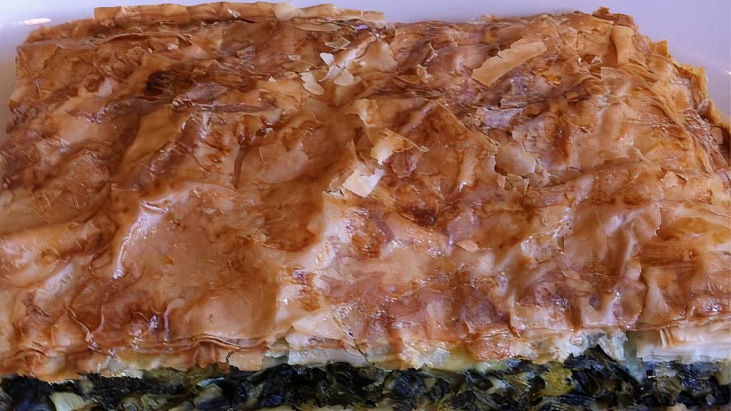 Spanakopita Plates · Spinach and feta in crispy filo dough. Served with choice of two sides and pita bread.