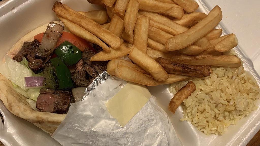 Beef Souvlaki Plates · Served with choice of two sides and pita bread.