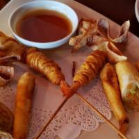 Duck Rolls · Deep-fried cylindrical rolls with tender roasted duck, leek, carrot and cucumber served with...