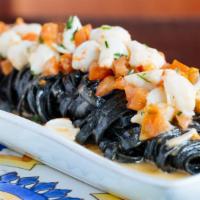Linguine · Sea urchin and crab with black squid ink.