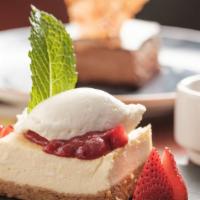 Cheesecake · Strawberry puree as garnish