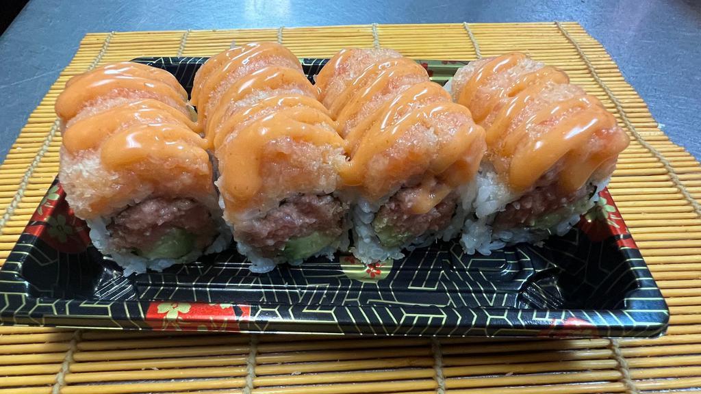 Sr12. Naruto Roll · Spicy tuna, avocado inside, topped with spicy salmon crunch.