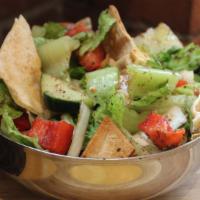 Fatoush Salad · Fresh tomatoes, onions, peppers, radishes, parsley, and mint, sprinkled with sumac and thoro...