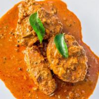 Kerala Fish Curry · Fish cooked in our special blend of spices
