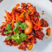 Chicken 65 · Marinated and deep-fried semi-dry chicken in a chili pepper-based sauce with fried chilies.