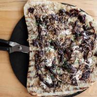 Mushroom Pizza · roasted rhode island mushrooms, fontina, parmesan, herbed ricotta, onion, saba.