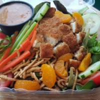 Oriental Crispy Chicken Salad · Crispy chicken diced up on top of a spring mix and julienned celery and carrots baby tomatoe...