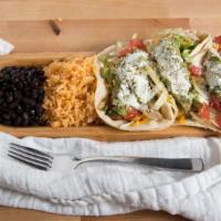 Tacos Con Peascod (Fish Tacos) · Three large corn tortillas filled with grilled tilapia, fresh cilantro and onion. Served wit...