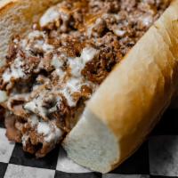 A Real Philly Cheesesteak · shaved ribeye from Pat LaFrieda, caramelized onion, white chedder 