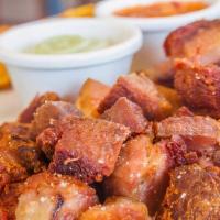 Pork Belly With Side Choice ( Chicharron ) · Chicharron de cerdo con tostones.