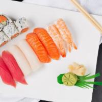 Sushi Deluxe · Salmon, tuna, white tuna, shrimp and spicy tuna roll. Eight pieces of sushi and one roll.