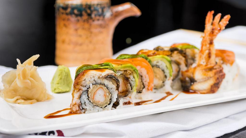 Dragon Roll · Spicy. Shrimp tempura roll topped with eel, smoked salmon, and avocado.