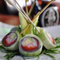 Ken Shin Roll · Kanikama, masago, tuna, and avocado wrapped with seaweed and cucumber outside.