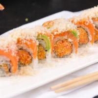Sunshine · Spicy. Spicy kani mixed with crunch inside topped with salmon, avocado, and crunch on top.