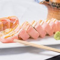Pink Lady Roll · Spicy. Spicy shrimp tempura, kani, crunch,  avocado, asparagus with pink soy paper  with cre...
