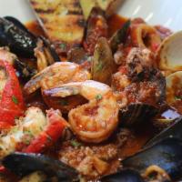 Seafood Cioppino · Sautéed shrimp, calamari, mussels and fish of the day in an olive oil, garlic, shallots, and...