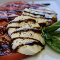 Caprese Salad · Fresh Buffalo Mozzarella cheese with tomatoes drizzled with balsamic vinegar ans extra virgi...