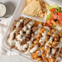 Grilled Chicken Kabob Over Rice · Our delicious Fresh Marinated Chicken Kabob topped with our famous in-house white sauce.