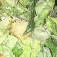 Caesar Salad · Romaine lettuce, shredded Parmesan cheese, croutons.