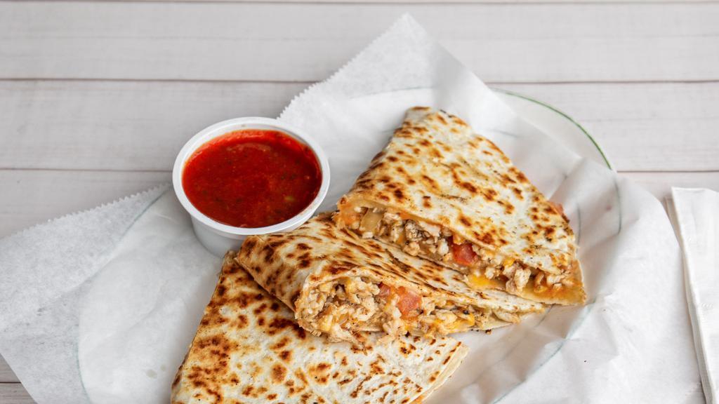 Carmines Chicken Quesadilla · Chopped chicken, cheddar cheese, sauteed onions, chopped tomatoes, sour cream and salsa