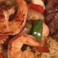 Sumo Combo · Grilled filet mignon and jumbo shrimp smothered with fresh mushroom and onion in a chef spec...