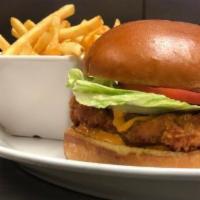Chloe'S Fried Chicken Sandwich · Crispy chicken breast topped with our homemade red pepper aioli, tomatoes, and lettuce serve...