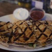 Steak Quesadilla · Choice of steak with cheddar, American and onions served with a side of sour cream and salsa.