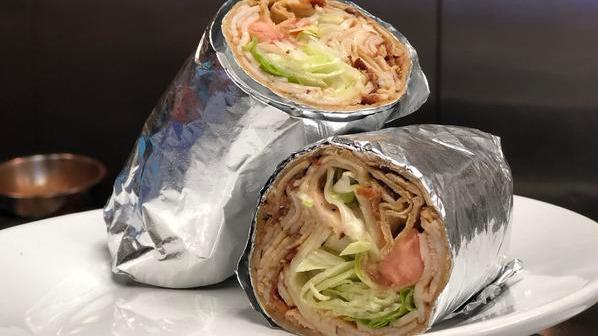 Turkey Club Wrap · Sliced turkey with bacon, provolone, lettuce, and tomato.