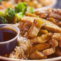 Chicken Teriyaki Rice Bowl · Grilled chicken in a teriyaki sauce served over white rice with broccoli, red onion, peas, c...