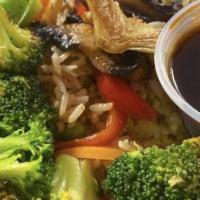Vegetable Medley Rice Bowl · Grilled zucchini, mushrooms, and artichokes served over white rice with broccoli, red onion,...