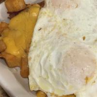 The Skillet Breakfast · A skillet full of home-fried potatoes  and your choice of diced ham, bacon, or sausage, blan...