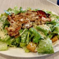 Caesar Salad · Romaine lettuce tossed with parmesan cheese, croutons and Caesar dressing.