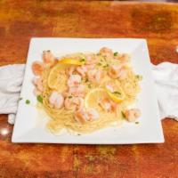 Shrimp Scampi · Shrimp in white wine sauce with garlic over angel hair pasta.