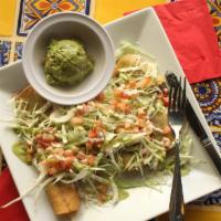 Taquitos · Shredded beef crispy taquitos topped with cabbage and tomatoes, spicy avocado and sour cream...