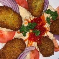 Falafel · Mashed chickpeas with celery, parsley, onions, garlic and herbs, served with hummus and shep...