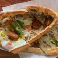 Combo Pide · Stuffed dough dish of mozzarella cheese, ground beef, beef sausage, peppers and egg topping.