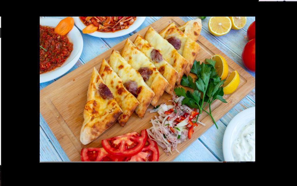 Sucuklu Pide · Stuffed dough dish of beef sausage, mozzarella cheese and peppers