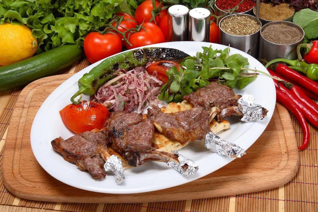 Lamb Chops · Marinated Lamb Chops cooked on char grill served with rice, shepherd salad and homemade bread