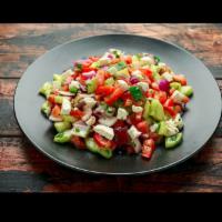 Shepherd Salad · (Çoban Salatasi) Tomatoes, feta cheese, onion, pepper, olives, cucumber, parsley in olive oi...