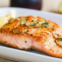 Salmon · Grilled garlic butter salmon with seasoning served with shepherd salad, rice and homemade br...